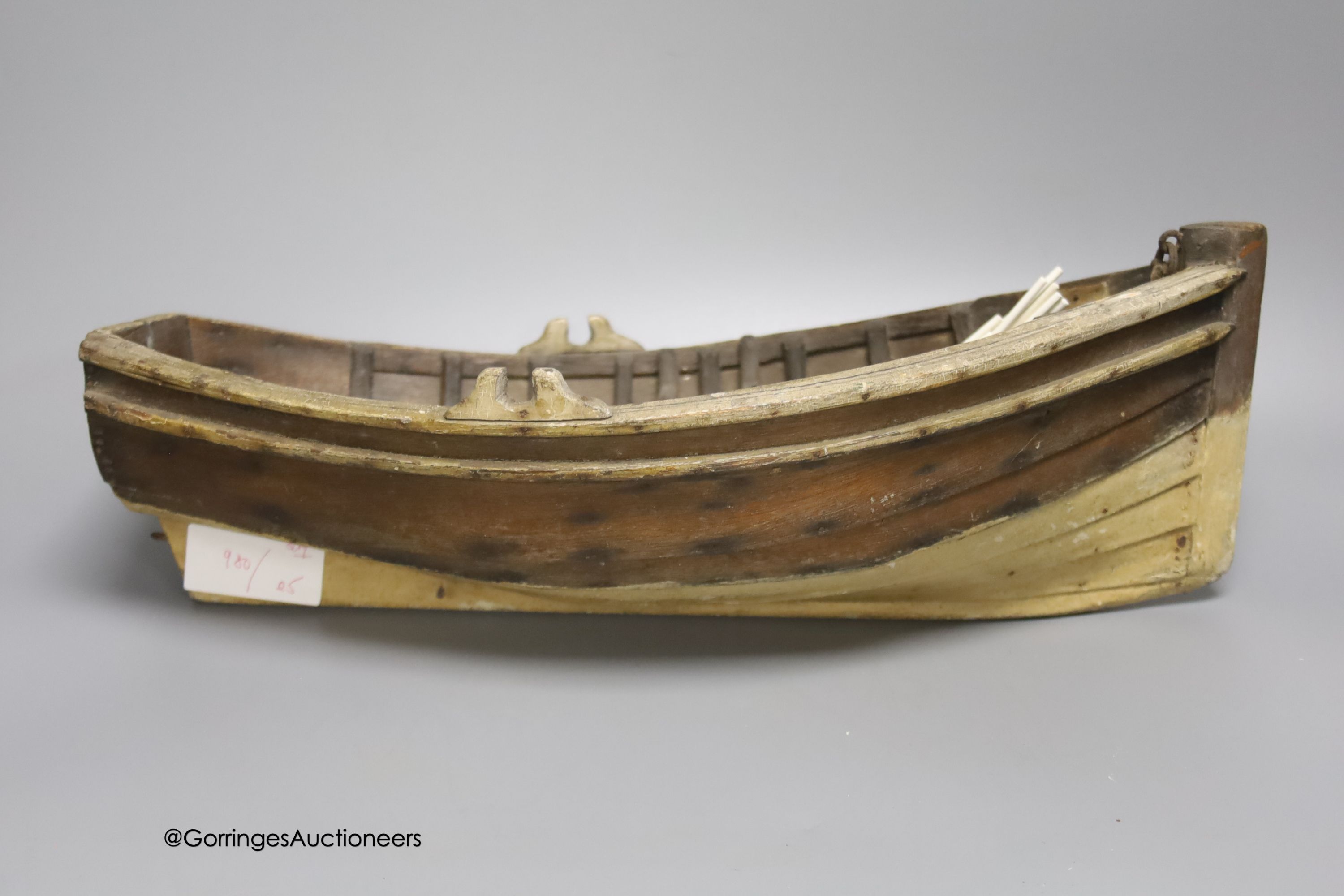 A clinker-built wood rowing boat, 41cm, and four smaller boat models